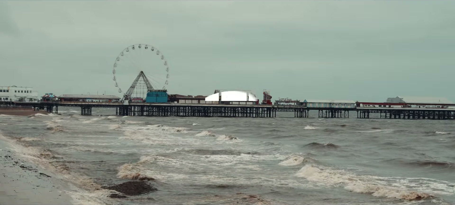 Central Pier and its big wheel over a grey sea in Blackpool, from the Pier Jam after movie