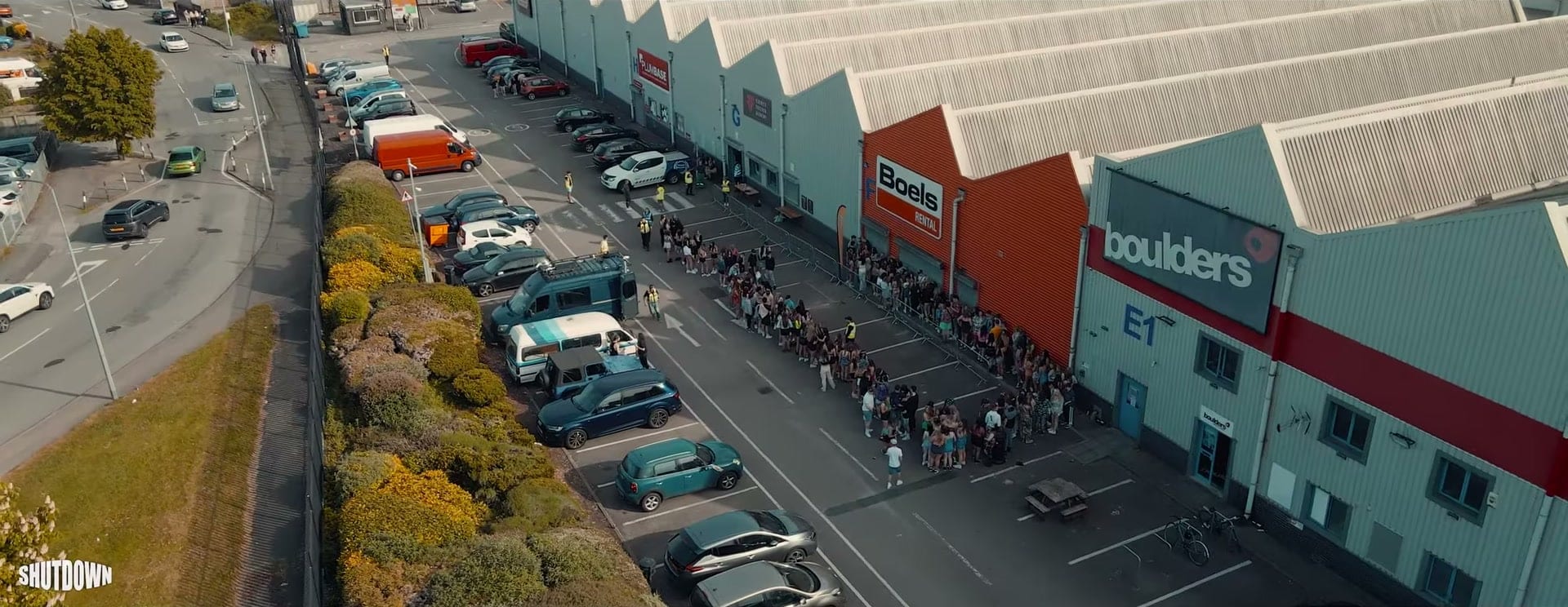 Drone view of the queue along a row of warehouse units in Cardiff for SHUTDOWN at Fluidity Freerun Academy
