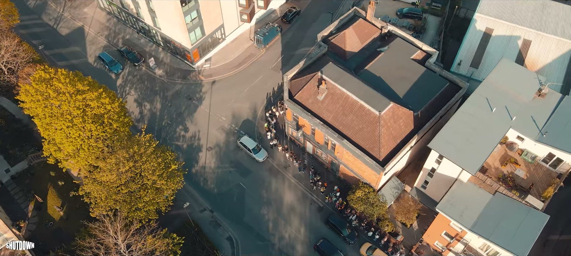 Drone view looking straight down on The Brook in Southampton, the queue lining the street beside it