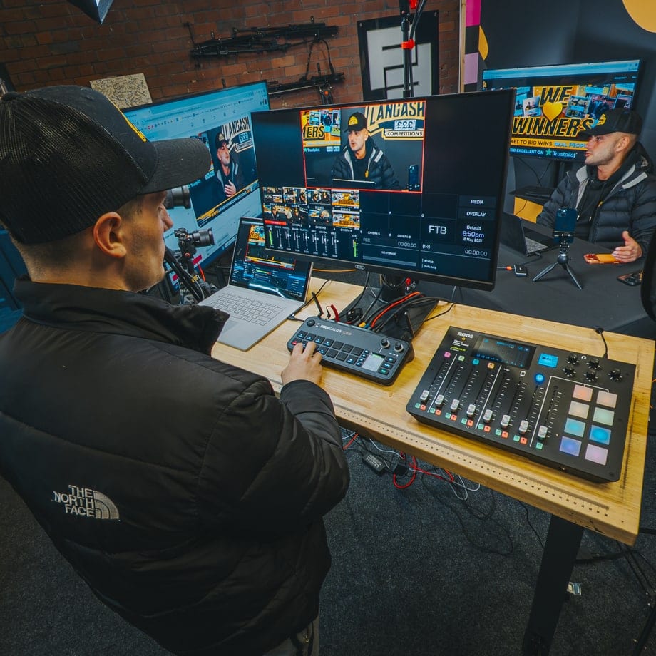 Operator switching cameras on a Rodecaster Video during a live stream in the studio