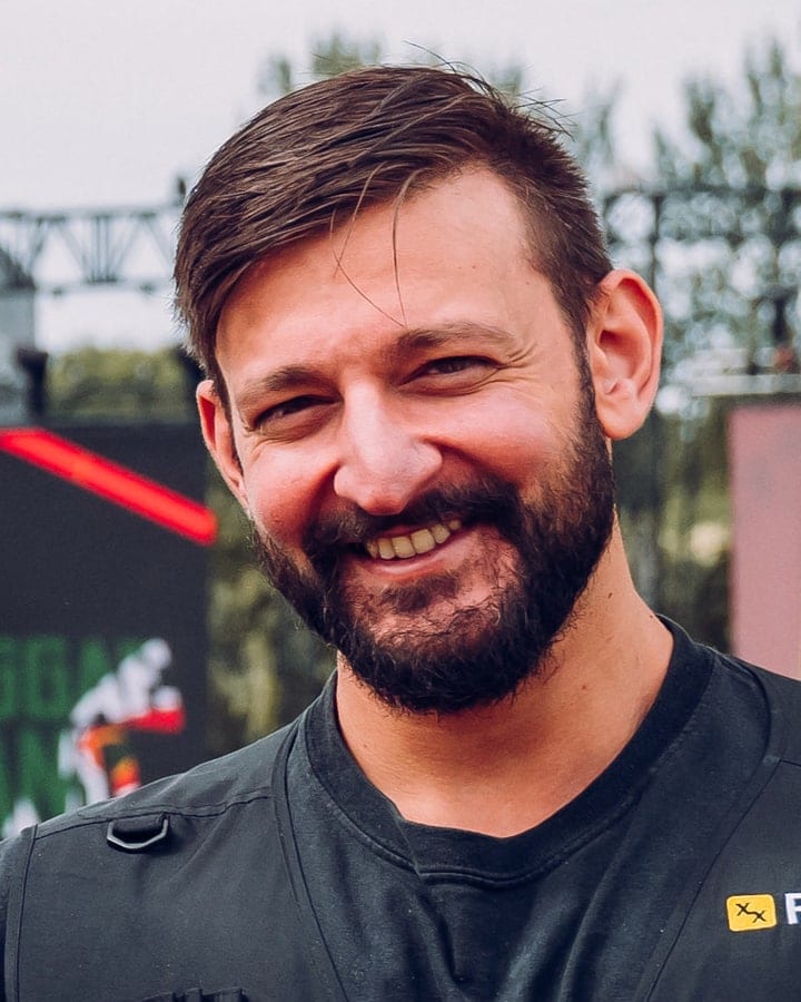 Arman at Reggae Land in a Flexxed vest, smiling